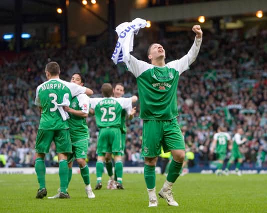 Abdessalam Benjelloun celebrates as Hibs lift the 2007 League Cup -  a happy association with the all-green kit.