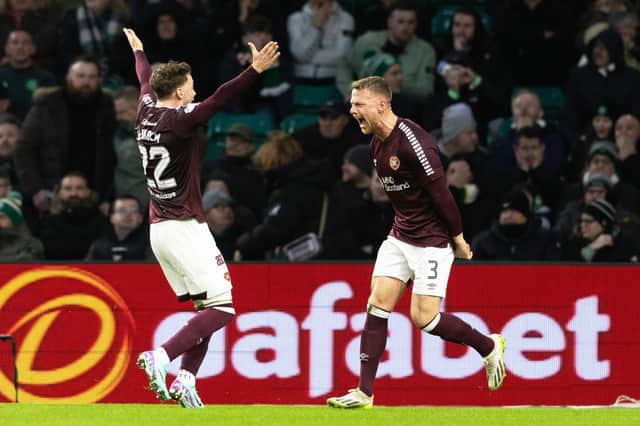 Stephen Kingsley celebrates with Aidan Denholm after scoring the free-kick which put Hearts 2-0 ahead against Celtic. Pic: SNS