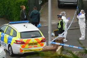 Forensics and police are on the scene in Fernieside Crescent, Edinburgh after a woman was found dead.