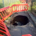 A giant sinkhole has appeared on the canal path near the Longstone Inn in Edinburgh. 