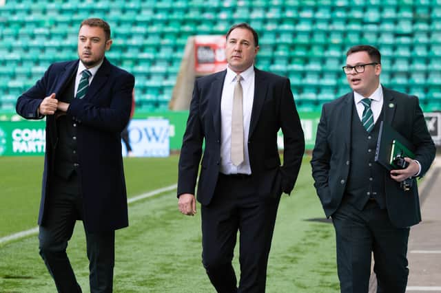 Mackay (centre), pictured with CEO Ben Kensell (left) and head of football operations Derek Whyte (right), is busy offloading unwanted assets.