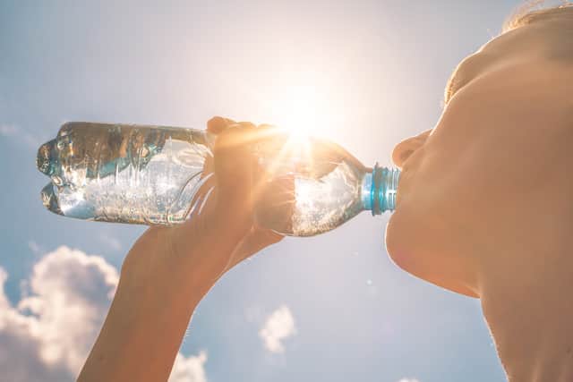 It's important to stay hydrated so you don't develop heat exhaustion. (Photo: Adobe Stock)