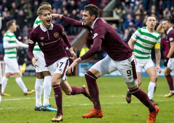 Harry Cochrane, left, celebrates his opening goal against Celtic with Kyle Lafferty
