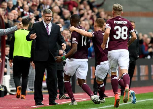 Hearts' Arnaud Djoum (centre) celebrates his opening goal with manager Craig Levein. Pic: SNS